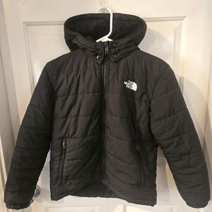 Used Kids Black North Face Puffer Size LG Reversible 2 And 1 Jacket.